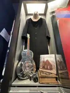 A guitar, hat and shirt featured on the cover of Alan Jackson’s Precious Memories album. Photo: Jaime Vaughn